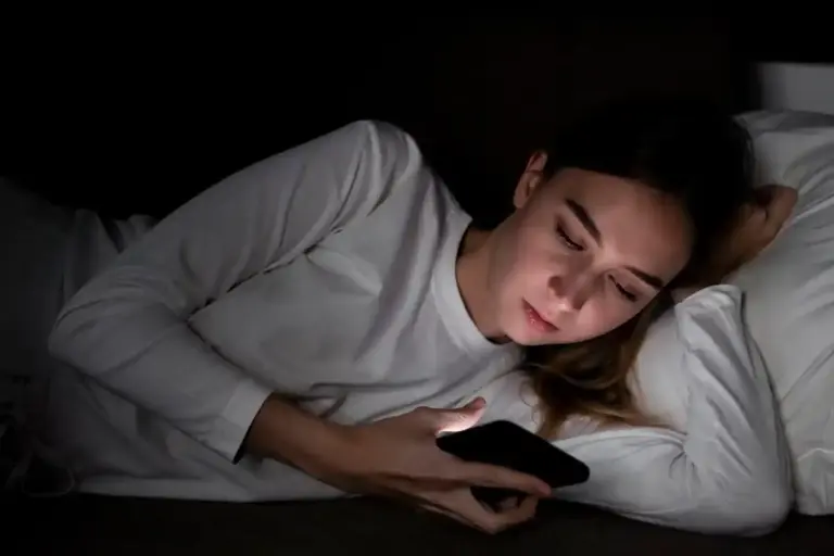 person avoiding phone before sleep