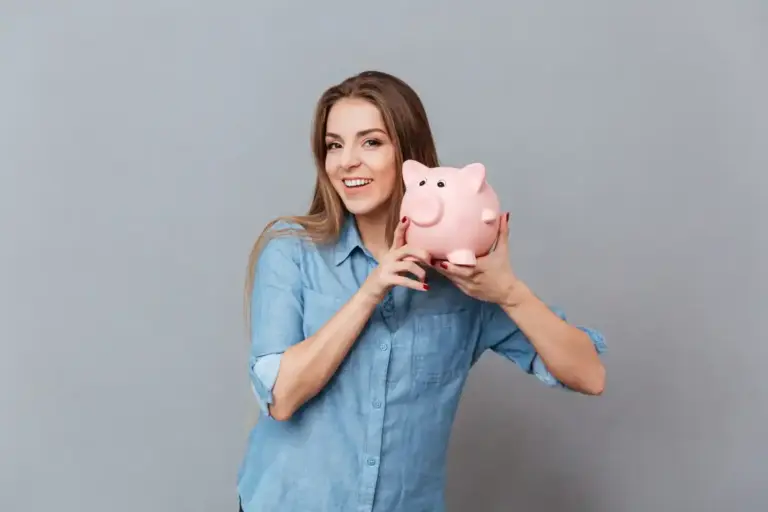 happy young person saving money with coins and piggy bank