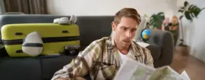 vacation booking mistakes traveler frustrated laptop
