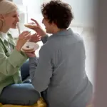 couple having calm conversation at home Netherlands