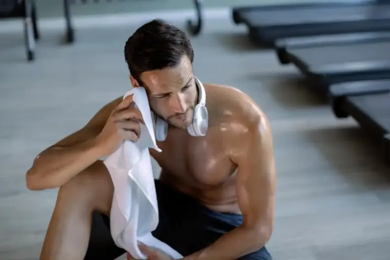 exhausted athlete resting after workout
